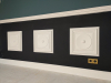 Orac wandpaneel W122 gemonteerd in wandpaneel W121, toegepast als lambrisering op de wand.